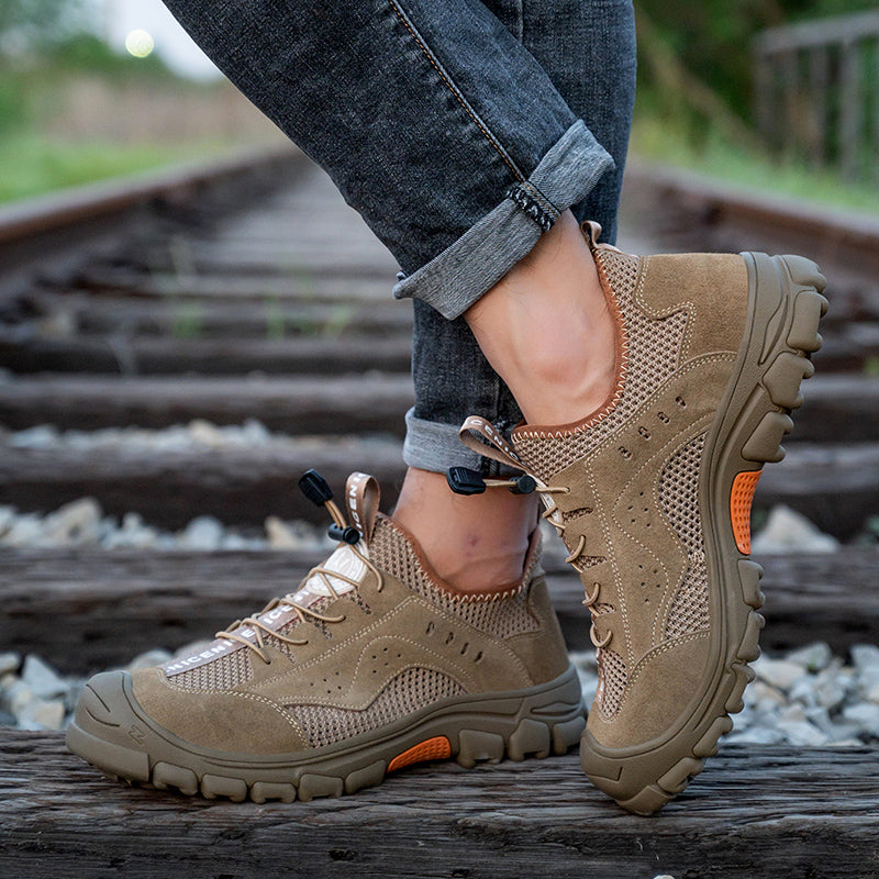 Paar Arbeitsschuhe Grau-Orange, Kevlar-Sohle – Studioansicht