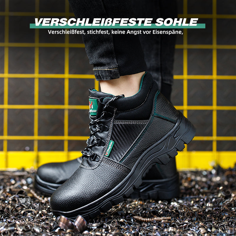 S3 Schuh Schwarz, Mesh-Einsatz, Baustellengitter im Hintergrund