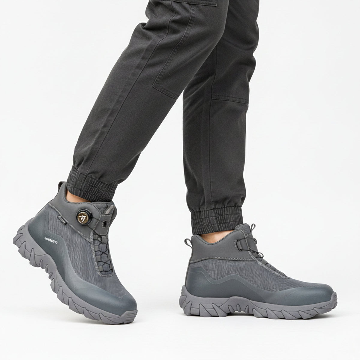 Henner Arot Sicherheitsstiefel mit Stahlkappe | Vierjahreszeiten & Warmfutter | Rutschfest Sicherheitsschuhe S3 Unisex in Grau – seitliche Gehbewegung