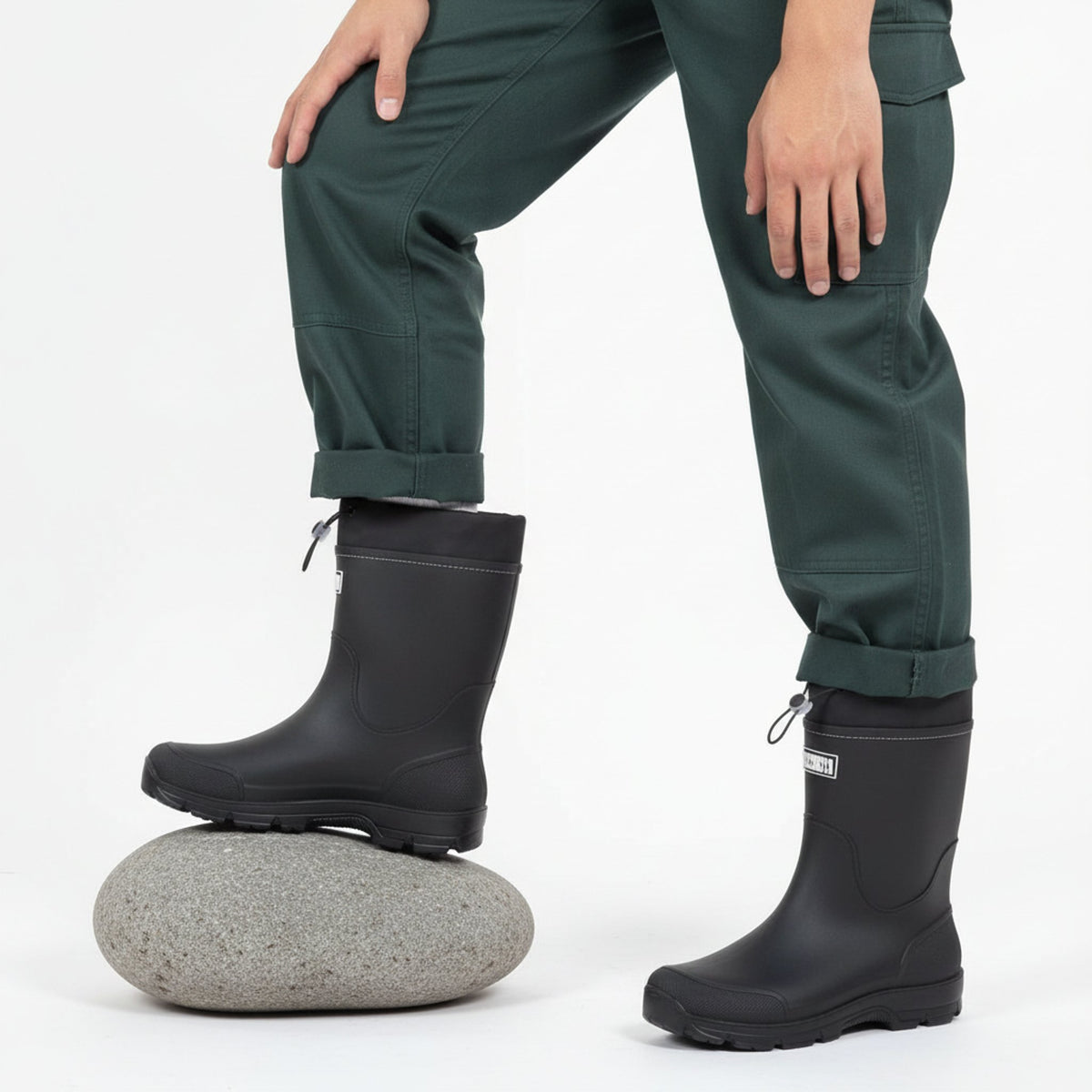 Henner Wassig Berufsschuhe Unisex in Schwarz – Fuß auf Stein