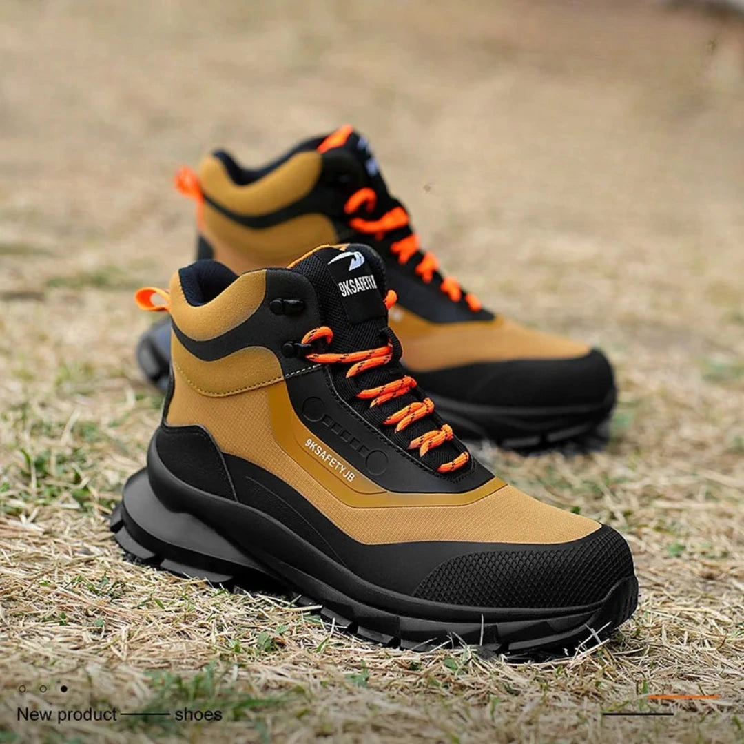 Ranger S3 Sicherheitsstiefel Sand/Schwarz am Fuß – kniende Arbeitsszene auf Stahlgitter