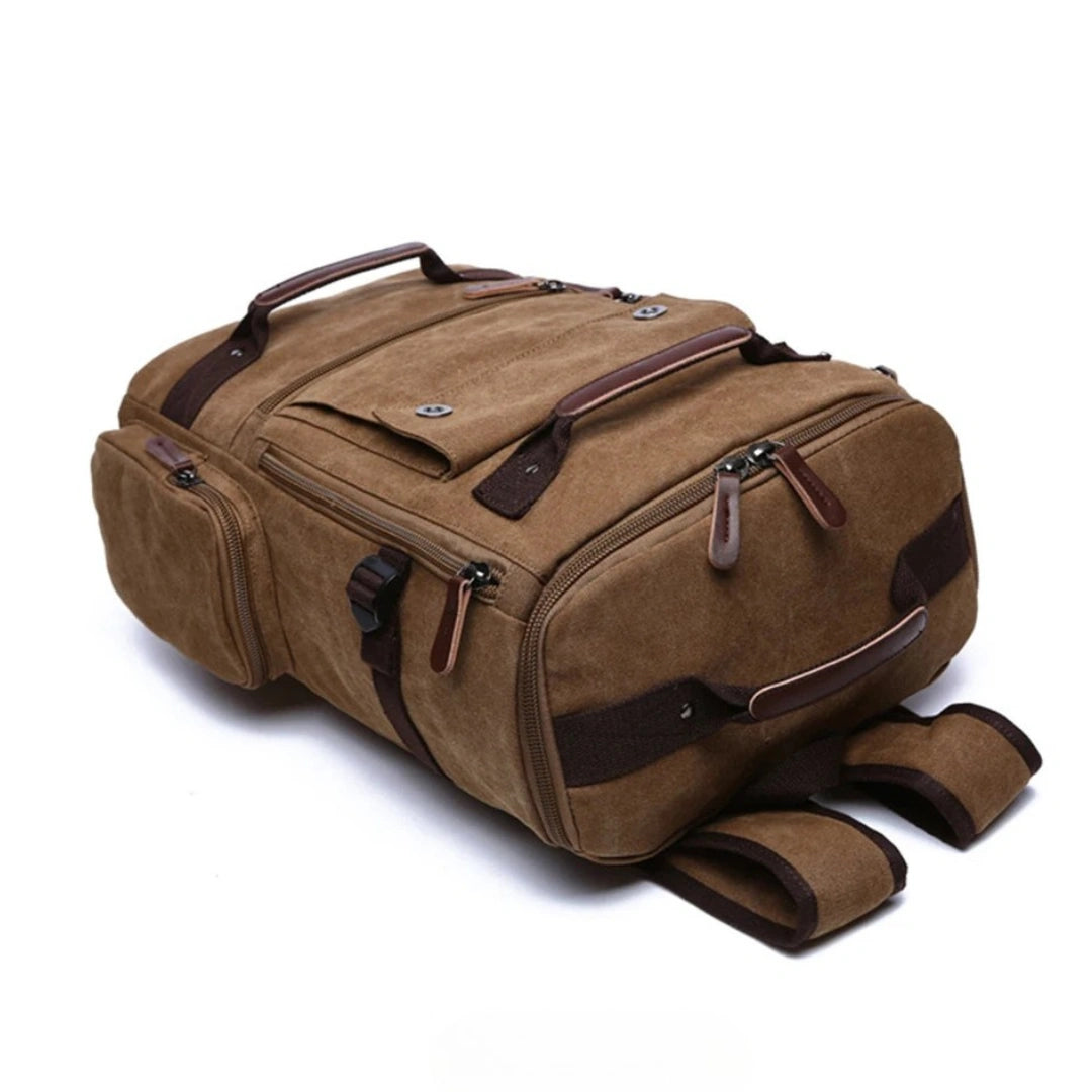 Vulcan Vintage Rucksack Braun – liegend, Seitenansicht mit Bodenfach und Gurten